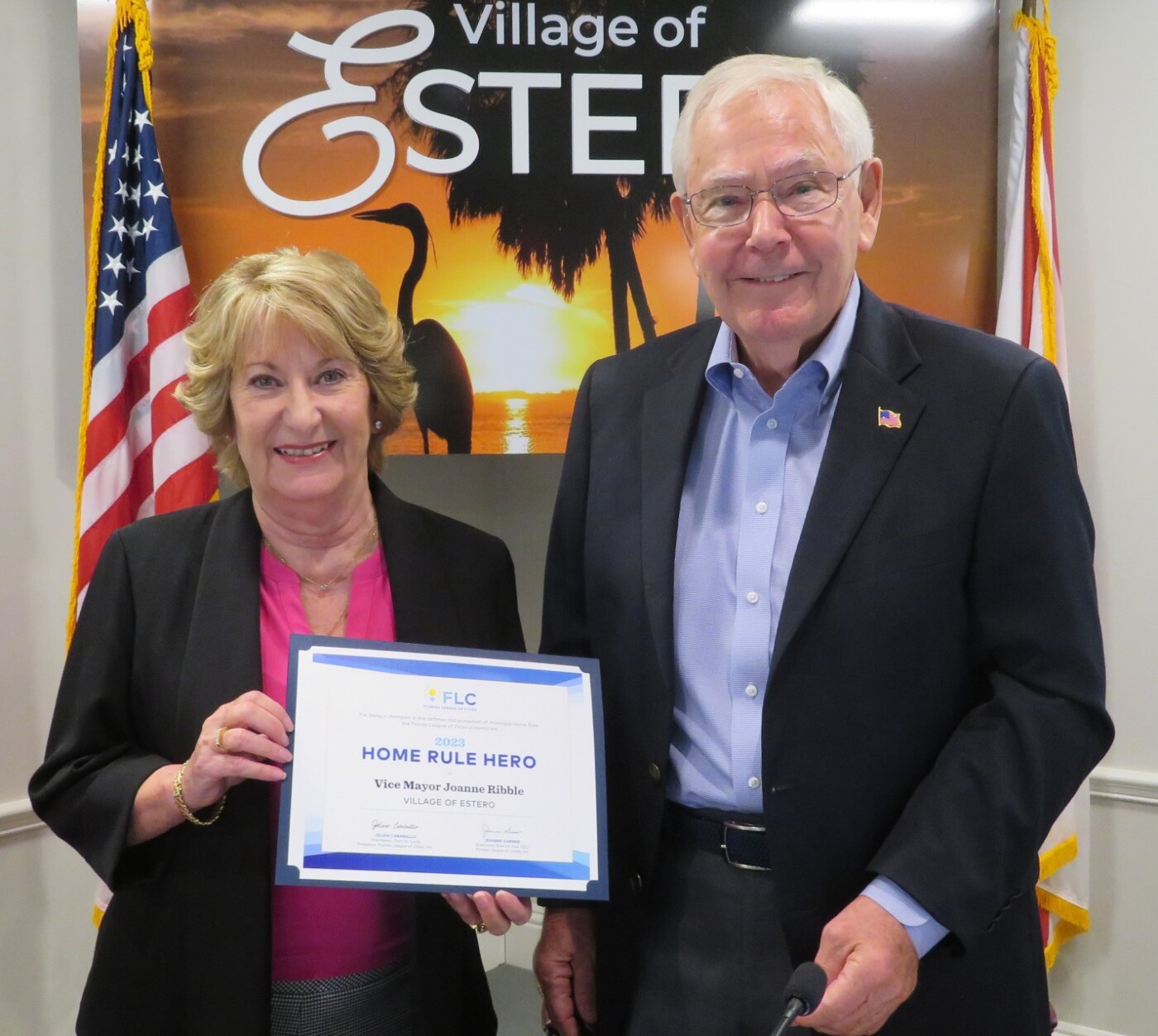 Mayor Jon McLain presenting Vice Mayor Joanne Ribble with the Florida League of Cities “Home Rule Hero Award.”